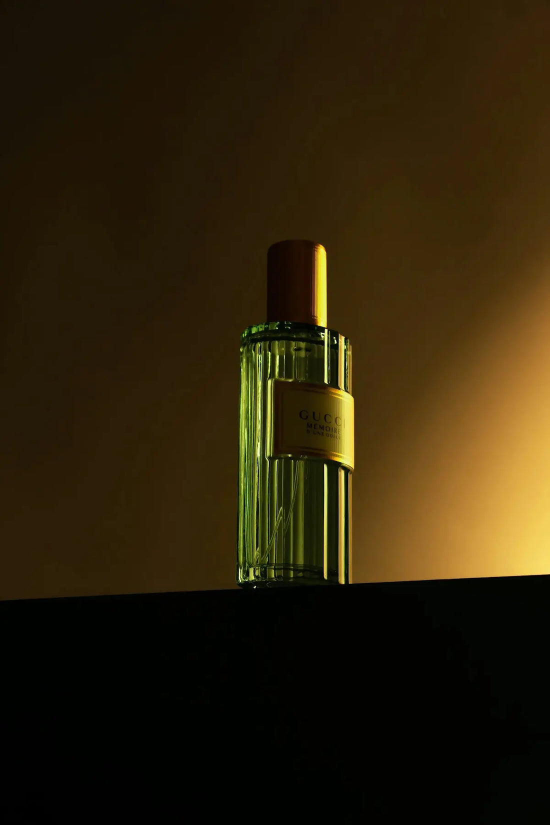 a bottle of perfume sitting on top of a shelf