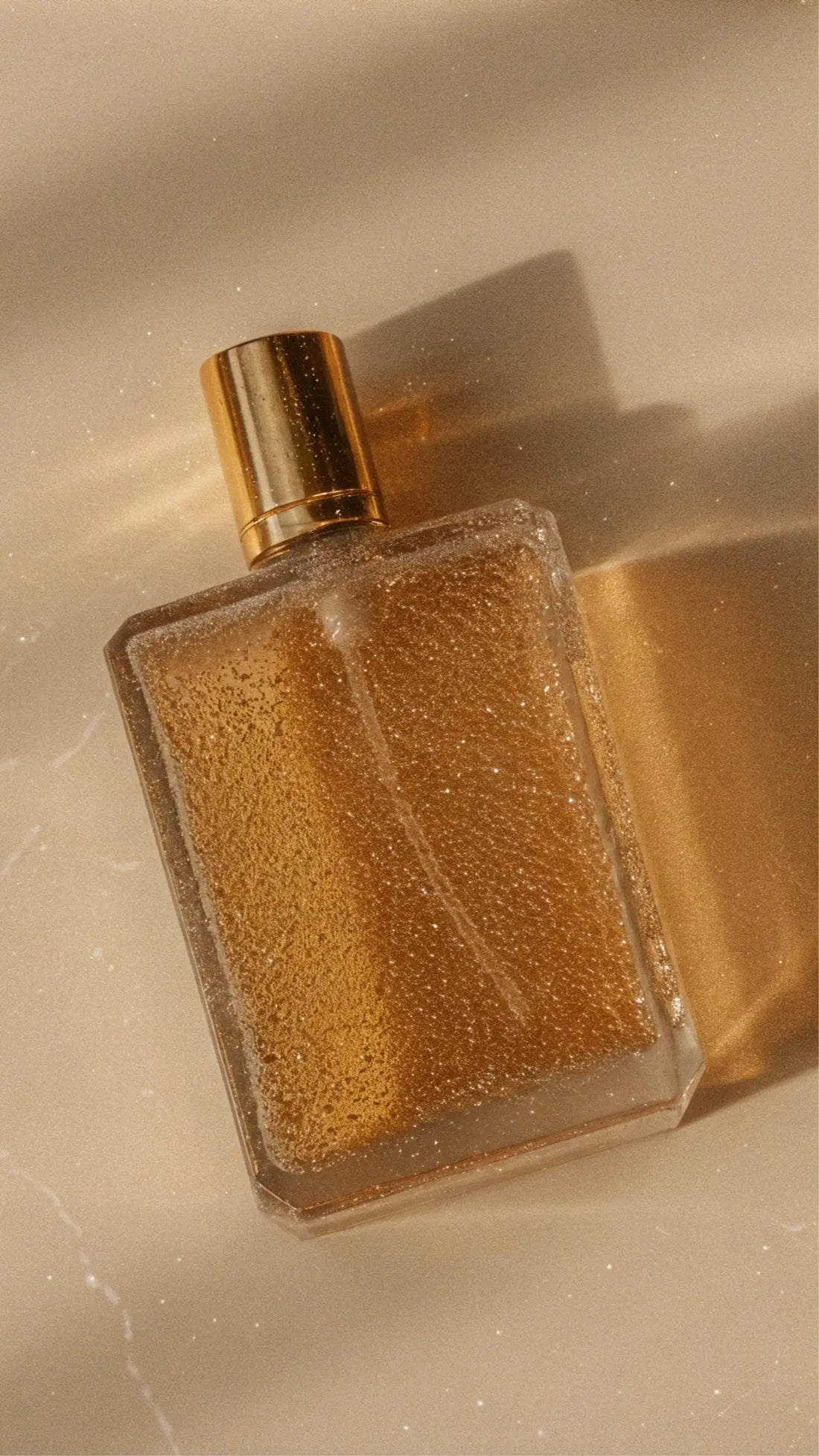 A bottle of perfume sitting on top of a counter